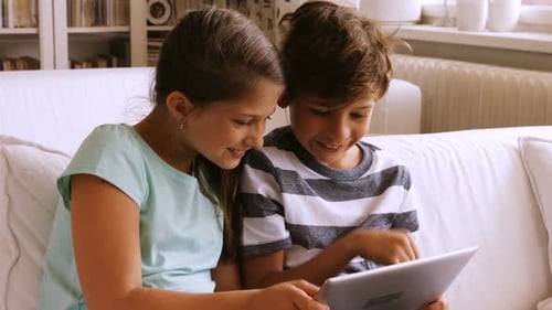 Children using digital tablet