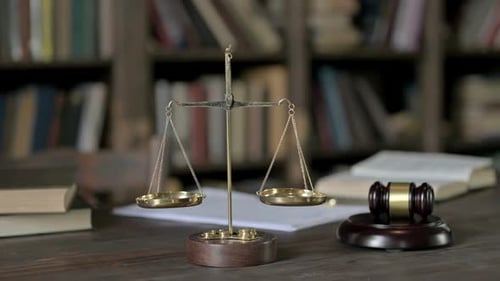Judge Pass Through Gavel and Gold Brass Balance Scale on Judge Table