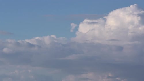 Heavenly Puffy Clouds Moving in the Sky