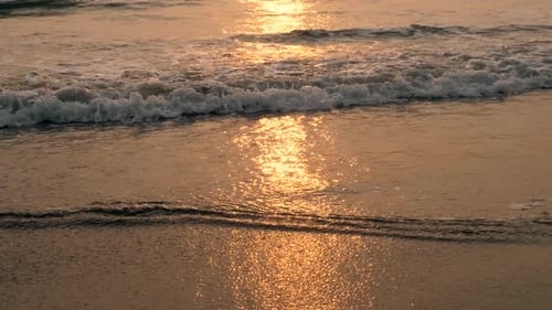 Amazing Beach Sunset with Endless Horizon and Lonely Figures in the Distance and Incredible Foamy