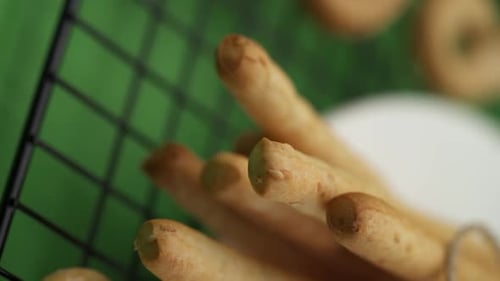 Vertical video, Close-up: Italian pastries on a lattice pattern, Italian bread sticks