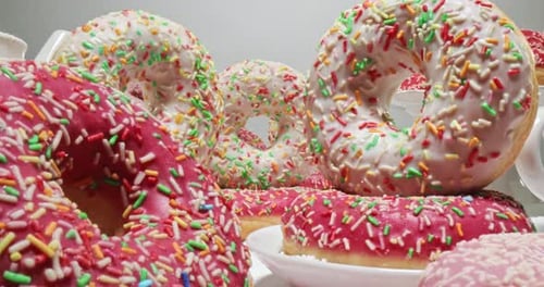 Tasty Donuts with Pink and White Icing and Sprinkles