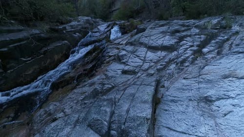 Rocky Riverbed with Cascading Waterfalls from Above