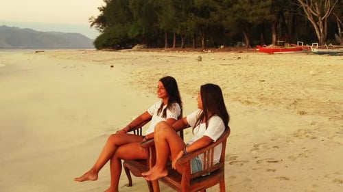 Girls happy together on marine coast beach time by turquoise sea and white sand background of Gili M