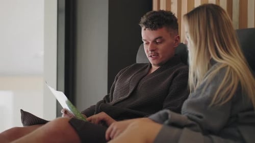 Joint Visit in Spa Center Adult Man and Woman are Resting in Lounge Zone and Chatting Discussing