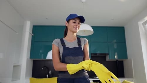 Attractive Woman with Nice Smile Dressed in Special Cleaning