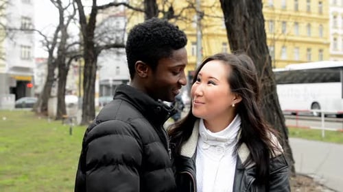 Happy Couple Smile To Camera - Black Man and Asian Woman - Urban Street with Car - City
