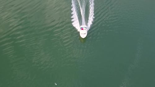 Aerial View of Wakeboarding Behind a Boat