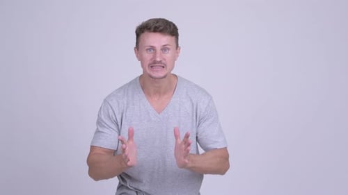 Frustrated Bearded Man Getting Bad News