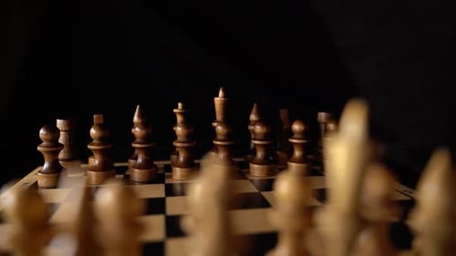 Dark Chess Pieces on the Chessboard Ready to Play