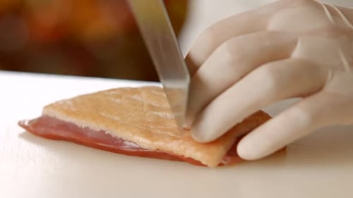 Chef Cutting Slices of Meat