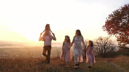 Family walking on a hill