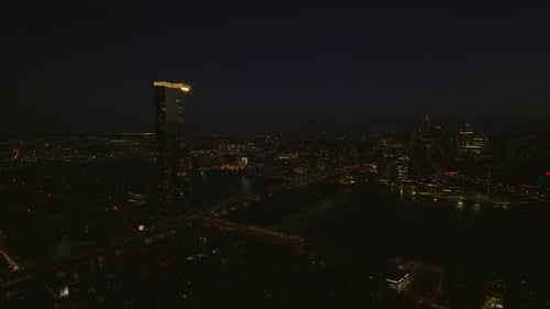 Aerial Panoramic Night Shot of One Manhattan Square Apartment Building with Illuminated Rooftop and