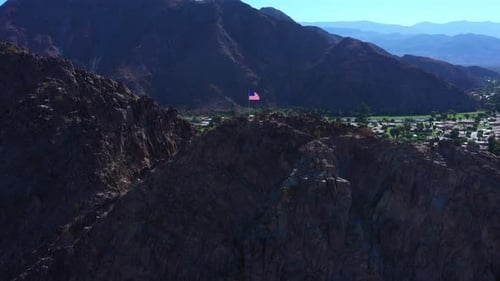 American Flag Flies above Picturesque Mountain Community