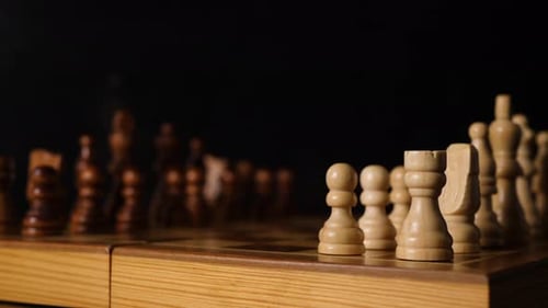 Slide behind white figures on a chess board