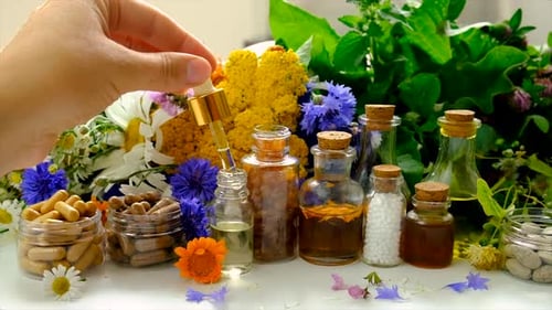 Natural Medicine Display With Dropper and Flowers