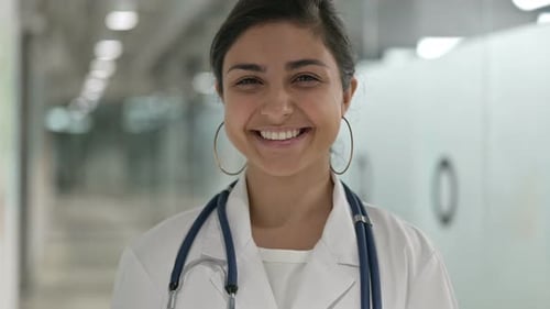 Smiling Medical Professional in Hospital Setting