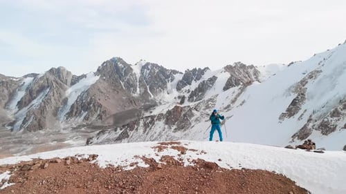 Man Dancing in the Mountain Summit Aerial Landscape