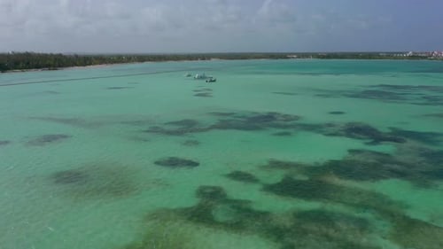 Drone Epic Pullback over the tropical exotic clear turquoise Dominican Republic Ocean Water, Aerial