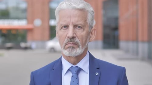 Close Up Portrait of Man in Suit and Tie