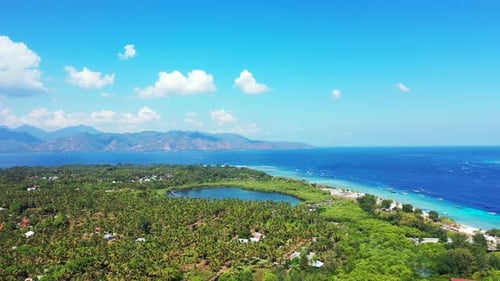 Paradise tropical island with palm trees forest around tourist villas and holiday resorts, surrounde