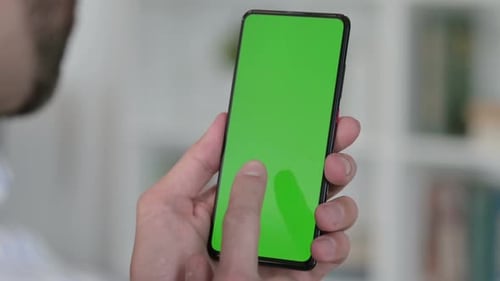 Man Using Green Chroma Key Screen of Smartphone
