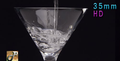Martini Glass Being Filled on Black Background
