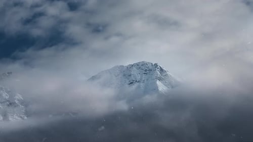 Misty snowy mountain peak