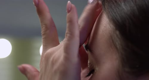 Woman Wiping Tears from Her Eye, Close Up