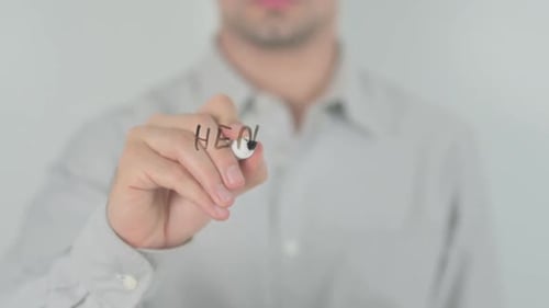 Man Writing Health Care Reform on Clear Surface