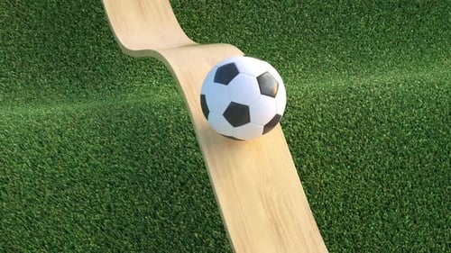 Satisfying looped animation of a soccer ball rolling on wood and grass background.