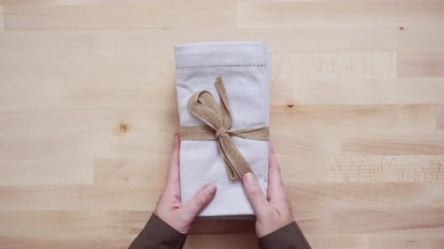Neutral Napkins Tied with Burlap on Wood Table