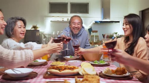 Family Toasting at Dinner Table Celebration