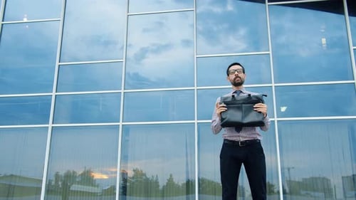 Cheerful Young Man Having Fun Outdoors Dancing Enjoying Business Victory at Work