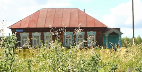 Old Village House And Green Grass