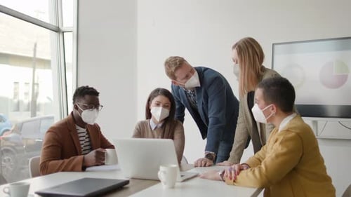 Diverse Team Collaboration During Pandemic at Office