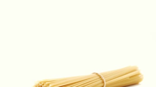 Rotating Bundle of Spaghetti Noodles Tied with Twine