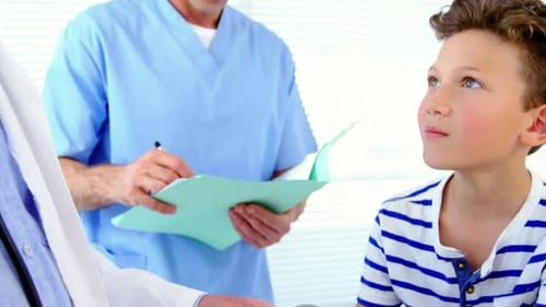Medical Checkup with Doctor Taking Boy's Blood Pressure