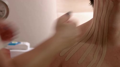 Kinesiology Tape Applied to Shoulder and Neck