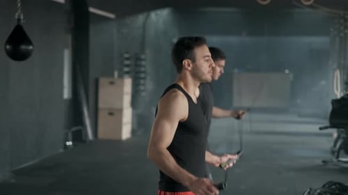 Athletes Jumps on Skipping Rope. In Sports Hall or Gym. Slow Motion