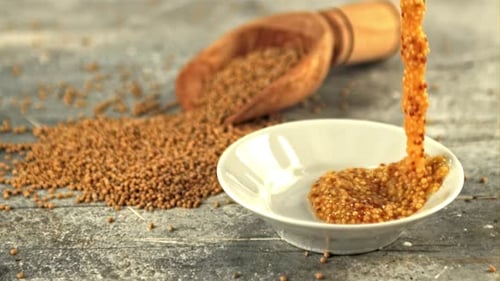 Whole Grain Mustard Sauce Pouring into Bowl