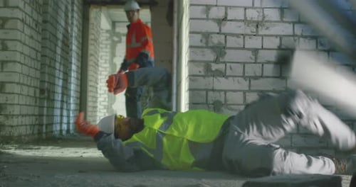 Builder Saving Colleague After Accident