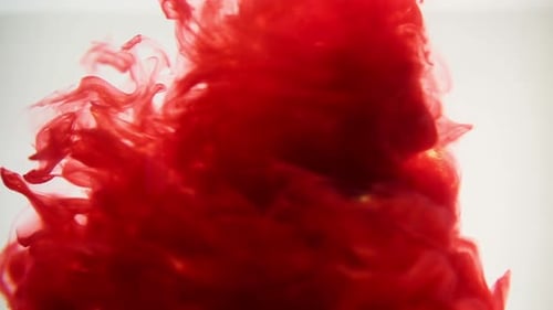 Red Ink Flowing Fluid Abstract Background