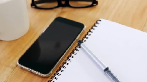 Overhead Shot of Desk with Phone and Coffee