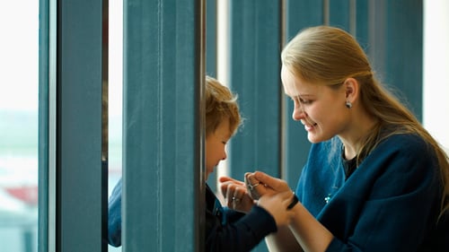 Mother and Child Counting Fingers by Window