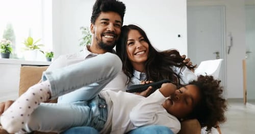 Happy Family Relaxing Together on the Sofa
