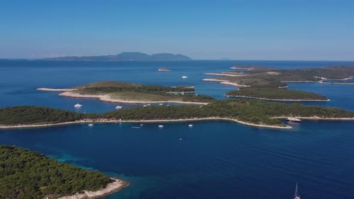 Aerial view on islands on sea. Blue water and islands with trees.