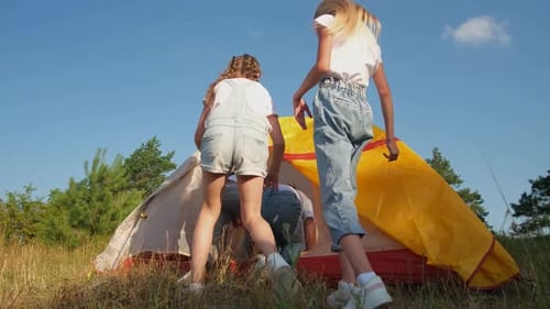 Girls Camping Together in Rural Nature Setting