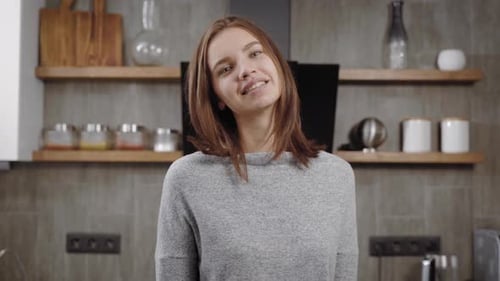 Woman Smiling in a Kitchen