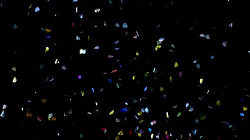 Colorful Confetti Falling on Black Background